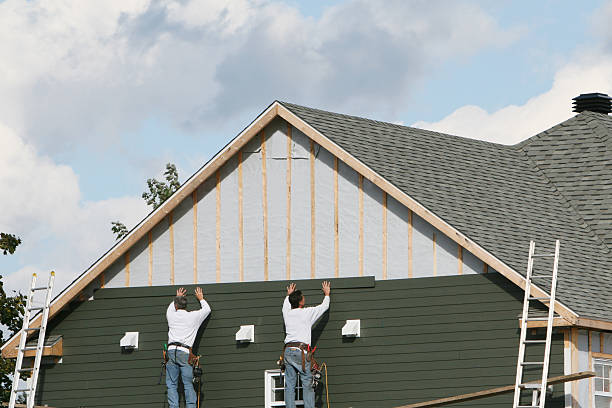 Professional Siding technician working in Rome, GA